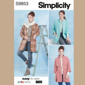 May include: Simplicity sewing pattern #S9853 for a women's jacket. The pattern includes three different styles: a plaid jacket, a turquoise jacket, and a pink jacket. The pattern is labeled "easy-to-sew".