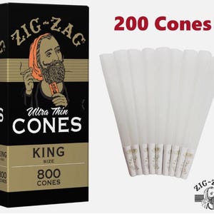 May include: A black box of Zig-Zag Ultra Thin King Size cones, with a graphic of a man with a beard and the text "Ultra Thin CONES". The image also shows a bundle of 200 cones.