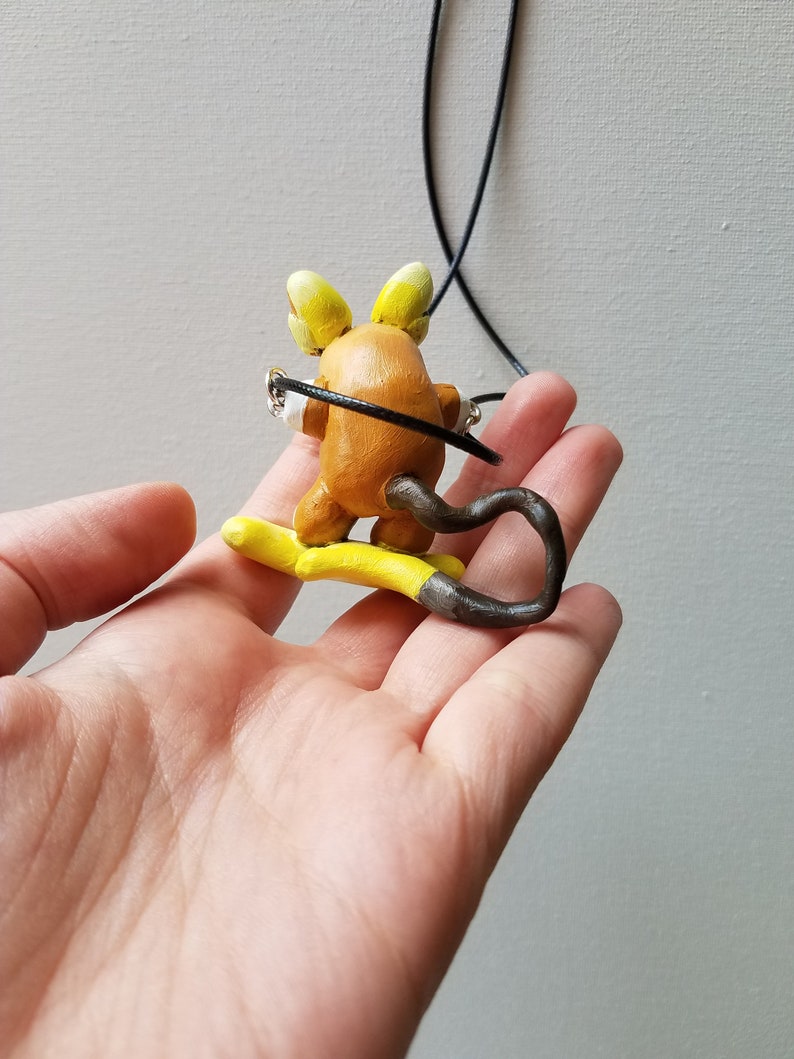 Surfing Raichu necklace