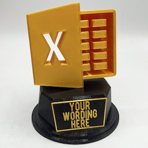May include: Gold trophy shaped like the Microsoft Excel icon with a black base and a customisable plaque that says "YOUR WORDING HERE".