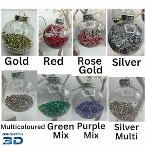 May include: A collection of eight clear spherical glass ornaments, each featuring a silver-toned metal cap and filled with small, metallic confetti pieces in gold, red, rose gold, silver, multicolored, green mix, purple mix, and silver multi.