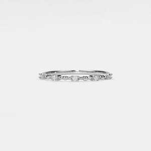 May include: A delicate silver band ring with small, clear gemstones set along the band.