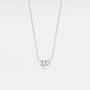 May include: A silver necklace with a pendant featuring the number 333 with a small diamond accent.