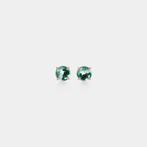 May include: A pair of stud earrings featuring round, moss agate stones with green and white patterns. The stones are set in gold-colored metal prongs, creating a delicate and elegant design. These earrings are a stylish accessory.