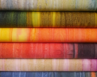May include: Stack of six fabric swatches with different colour gradients. The swatches are layered on top of each other, with the top swatch being a light beige with brown and green streaks. The second swatch is a dark green with yellow and brown streaks. The third swatch is a yellow with orange and red streaks. The fourth swatch is a red with orange and black streaks. The fifth swatch is a light beige with pink and brown streaks. The bottom swatch is a blue with white streaks.