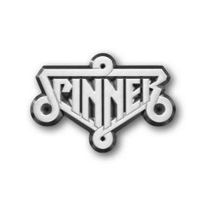 May include: A silver-colored metal pin with the word "SPINNER" in a stylized font. The pin has a black outline and decorative swirls on the sides. The design is set against a white background.