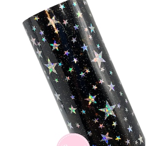May include: A roll of black vinyl with a holographic star pattern. The stars vary in size and reflect multiple colors. The vinyl is from Lorena's Boutique Shop.