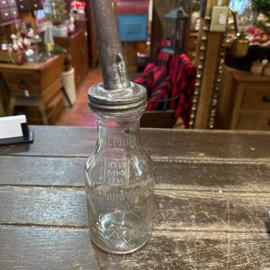 Vintage old oil jar with original spout