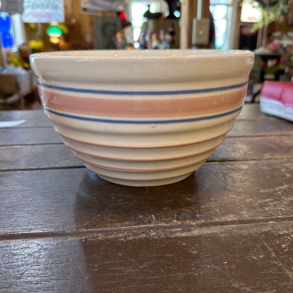Vintage older cream toned with pink and blue bands mixing bowl. Made by Mccoy pottery.