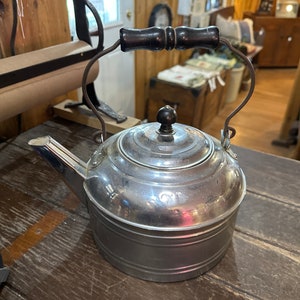 Antique nickel coated larger coffee kettle. 11L 5 wide.