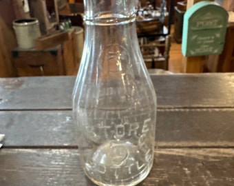 Vintage store embossed 5 cent milk bottle