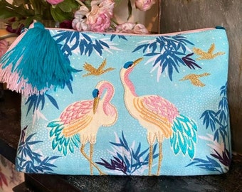 Embroidered crane make up bag with velvet, beads and tassel detailing.