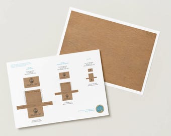 May include: A printable sheet featuring templates for small brown paper boxes with oval portraits and text, alongside a separate sheet with a solid brown wood grain pattern. The instructions include text for cutting, folding, and using double-sided tape.