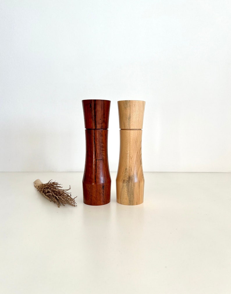 Wooden curved tapered shape salt and pepper grinders made from Australian Jarrah and Norfolk island pine timbers