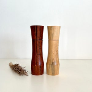 Wooden curved tapered shape salt and pepper grinders made from Australian Jarrah and Norfolk island pine timbers
