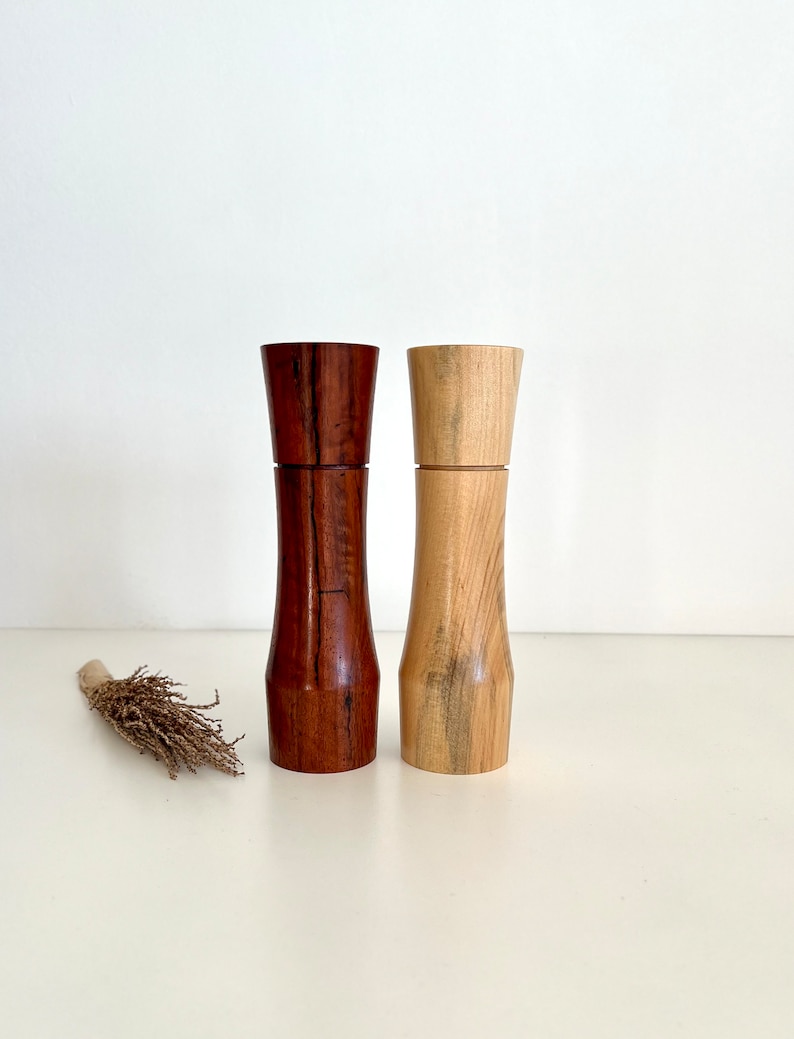Wooden curved tapered shape salt and pepper grinders made from Australian Jarrah and Norfolk island pine timbers