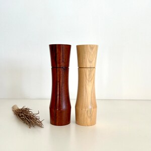 Wooden curved tapered shape salt and pepper grinders made from Australian Jarrah and Norfolk island pine timbers