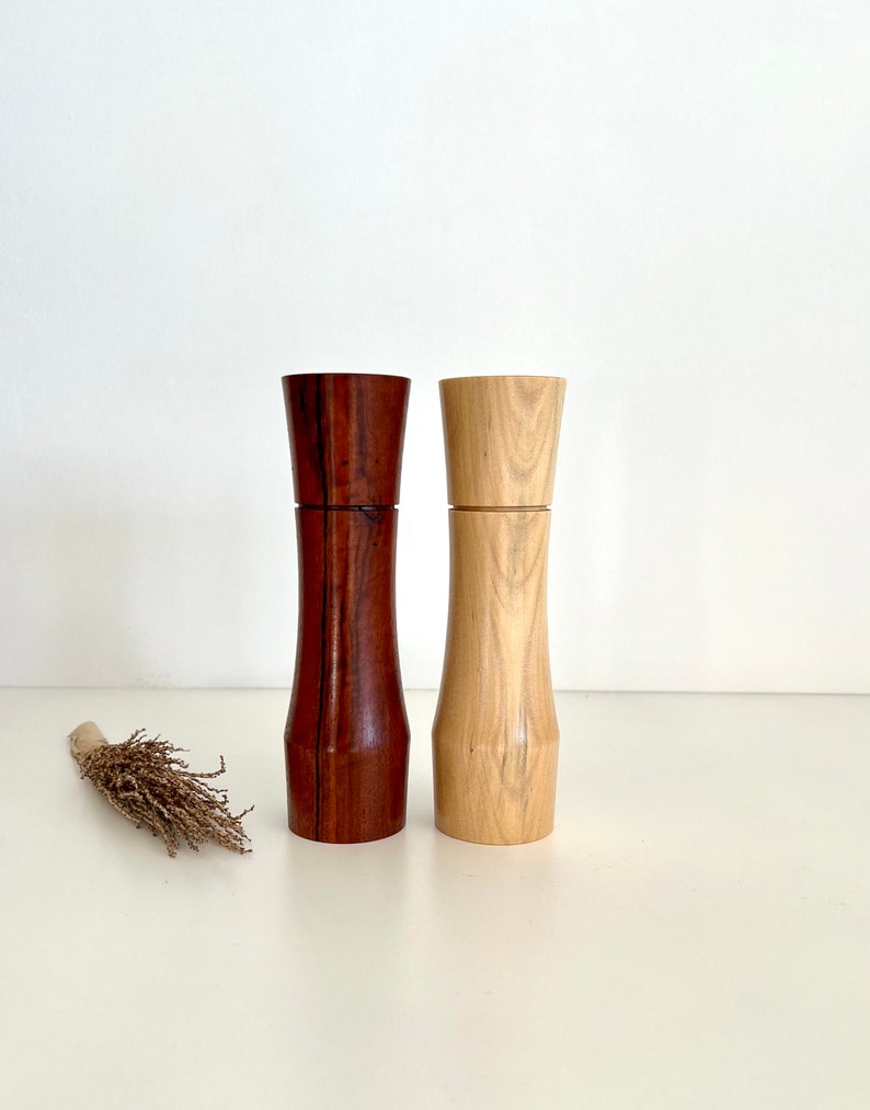 Wooden curved tapered shape salt and pepper grinders made from Australian Jarrah and Norfolk island pine timbers