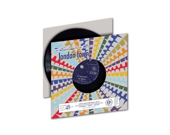 May include: A black 45 RPM vinyl record with a colorful sleeve. The record features the text "The Biggest Star on Record london town" and the song title "Say What It's Worth" by Skip McTell. The sleeve features a colorful, geometric design.