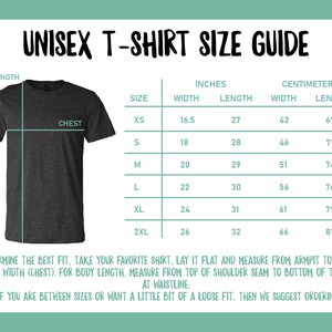 May include: A gray unisex t-shirt size guide with measurements in inches and centimeters. The guide includes chest and length measurements for sizes XS to 2XL. Instructions on how to measure a shirt are also included.