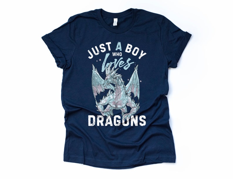 May include: Navy blue t-shirt with a white graphic of a dragon and the text "Just a boy who loves dragons".