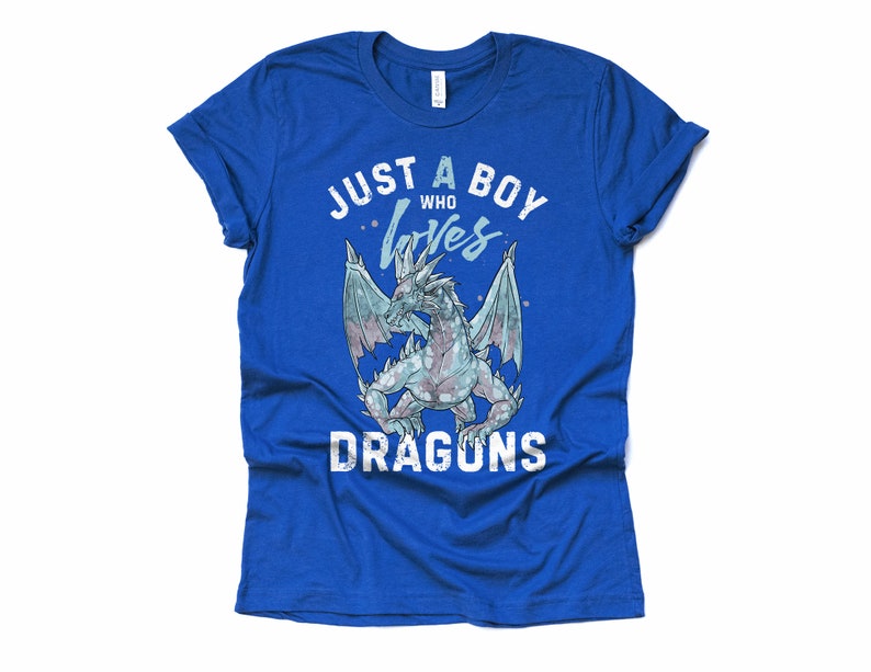 May include: A royal blue t-shirt with a white distressed graphic that says "Just a boy who loves dragons". The graphic features a blue and white dragon with wings spread.