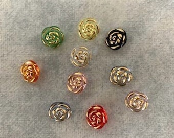 May include: Assortment of 10 rose-shaped buttons in various colors, including gold, silver, black, green, red, and pink.