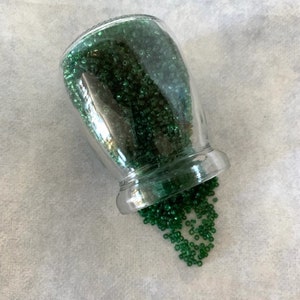 jar of tiny green seed beads, green seed beads, tiny beads, seed beads, bead jar, green beads bulk, small glass jar, seed beads bulk, green