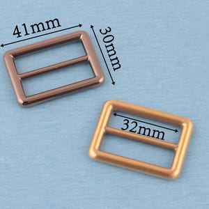 4 st metallspänne med trippelglidning: 32 mm väskremsjustering bild 2