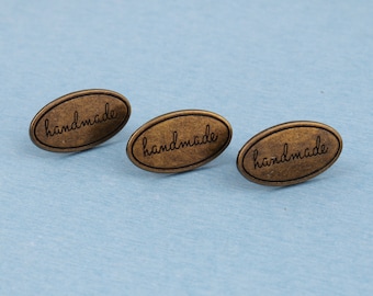 Handgjord metallväsksetikett i brons - 40 x 19 mm