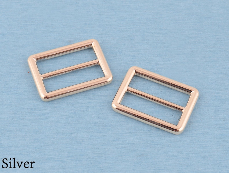 4 st metallspänne med trippelglidning: 32 mm väskremsjustering Silver