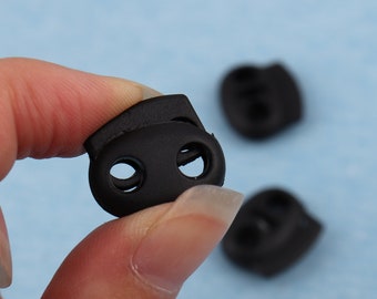 Black Plastic Double Hole Cord Lock: 20x17mm Toggle Stopper