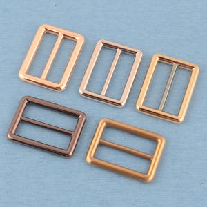 4 st metallspänne med trippelglidning: 32 mm väskremsjustering bild 1