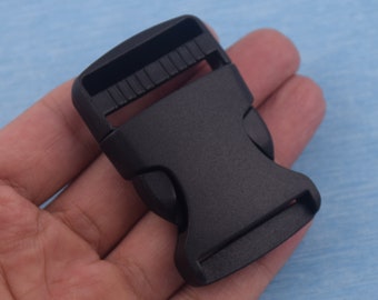 Schwarze gebogene Kunststoffschnalle: 3,2 cm Riemenspanner