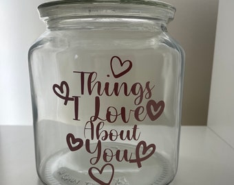 May include: A clear glass jar with a lid, decorated with red hearts and the text "Things I Love About You".