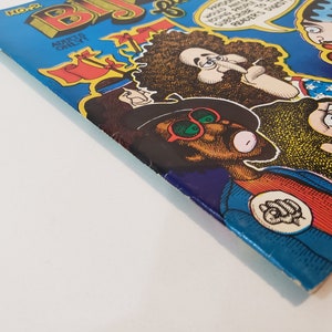 May include: A vintage comic book titled "Bijou Funnies" with a blue cover and cartoon illustrations. The cover features several characters with exaggerated features and speech bubbles. The text "ADULTS ONLY" is visible.
