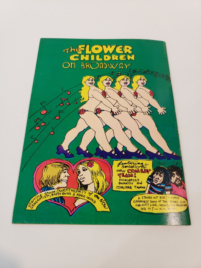 May include: A vintage green poster with the title "The Flower Children on Broadway." The poster features cartoon illustrations of nude figures with flower accents, musical notes, and text promoting a comedy team and show reviews.