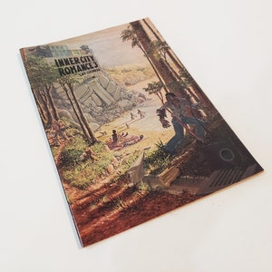 May include: A vintage comic book titled "Innercity Romance 3" by Guy Colwell. The cover art depicts a beach scene with figures, trees, and a man walking down a hill. The color palette includes greens, browns, and blues.