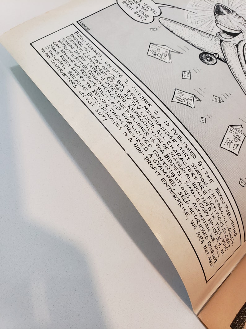 May include: An open comic book page with black and white illustrations and text. The text includes the title "Bijou Funnies" and the publisher's information. The artwork features a cartoon character with an airplane.