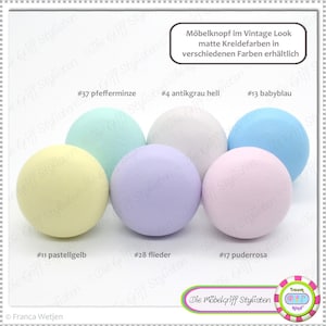 May include: Assortment of ten round knobs in various pastel colors, including pale yellow, light blue, lavender, mint green, and light pink. The knobs are labeled with numbers and color names, such as #11 pastellgelb, #13 babyblau, #17 puderrosa, #28 flieder, and #37 pfefferminze. The text "Möbelknopf im Vintage Look matte Kreidefarben in verschiedenen Farben erhältlich" is at the top of the image.
