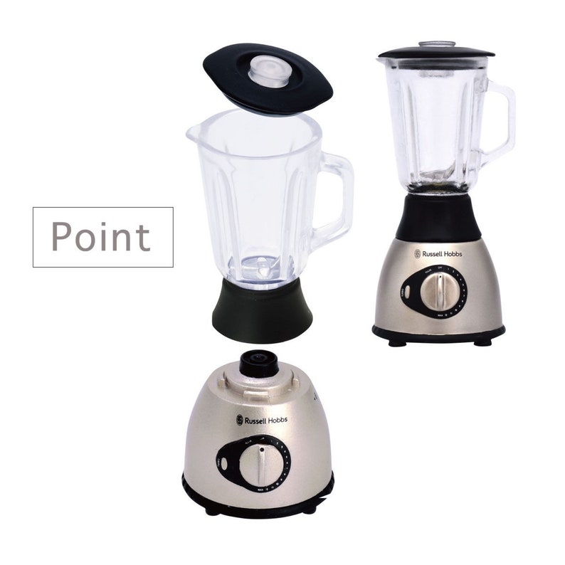 May include: A silver blender with a clear plastic container and a black lid. The blender has a black base with a silver knob and the words "Russell Hobbs" printed on it.