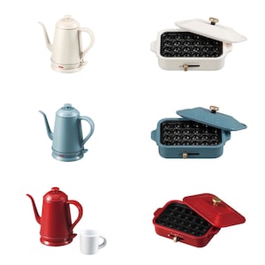 May include: A collection of three electric gooseneck kettles in cream, blue, and red, alongside three matching rectangular electric takoyaki pans with lids, each featuring a gold-tone knob and a small white mug next to the red kettle.