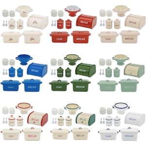May include: A set of ten miniature kitchenware items in various colours, including red, blue, green, and white. The items include bread boxes, cake containers, sugar and salt shakers, and colanders. Each item has a different label, including "Bread", "Cake", "Sugar", and "Salt".