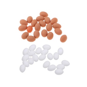 May include: A collection of brown and white plastic eggs. The brown eggs are arranged in a pile, while the white eggs are scattered around them.