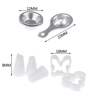 May include: A collection of baking tools, including a small metal bowl (12mm), a metal egg separator (22mm), white piping tips (8mm), and two white cookie cutters (10mm) in a butterfly and Mickey Mouse shape.