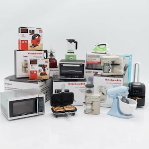 May include: A collection of miniature kitchen appliances, including a microwave, toaster oven, blender, and mixer. The appliances are in various colors, such as silver, black, and light blue, and are displayed with their original packaging.