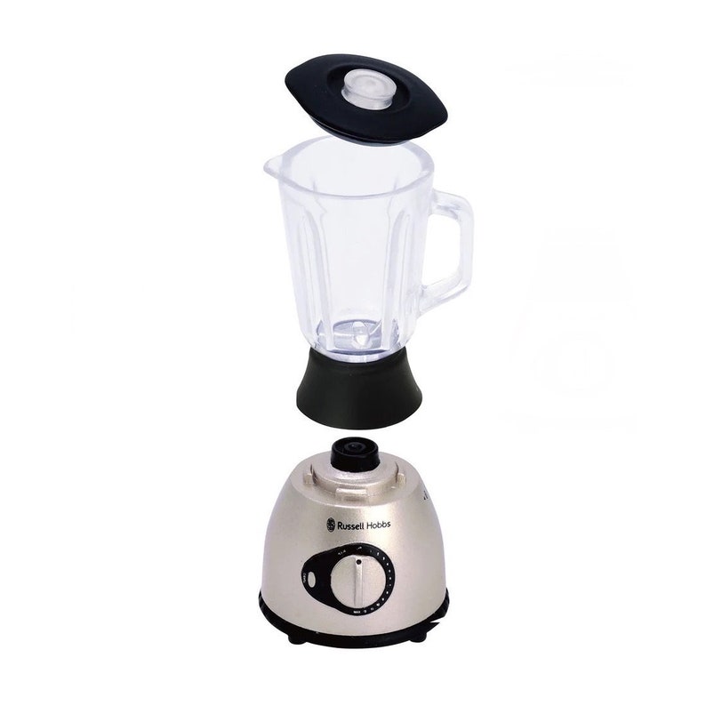 May include: A silver blender with a clear plastic pitcher and a black lid. The blender has a control knob with a dial and the text "Russell Hobbs" printed on the front.