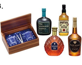 May include: A set of miniature liquor bottles and glasses in a wooden box. The bottles are labelled "The Kojimachi Whisky", "Remen Hours", "Petit Tresor VSOP", and "Ami Netter XO".