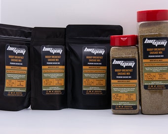 May include: Four different sizes of Big Guy Outdoors Big Guy Breakfast Sausage Mix seasoning. The seasoning is in black bags and clear jars with red lids. The labels are black with white text and say "Big Guy Outdoors Big Guy Breakfast Sausage Mix Premium Sausage Mix Works with all meats". The labels also list the net weight and package size. The seasoning is a blend of herbs and spices.