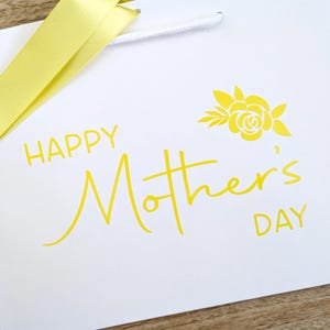 Gift bag with brimstone yellow text and lemon ribbon.
